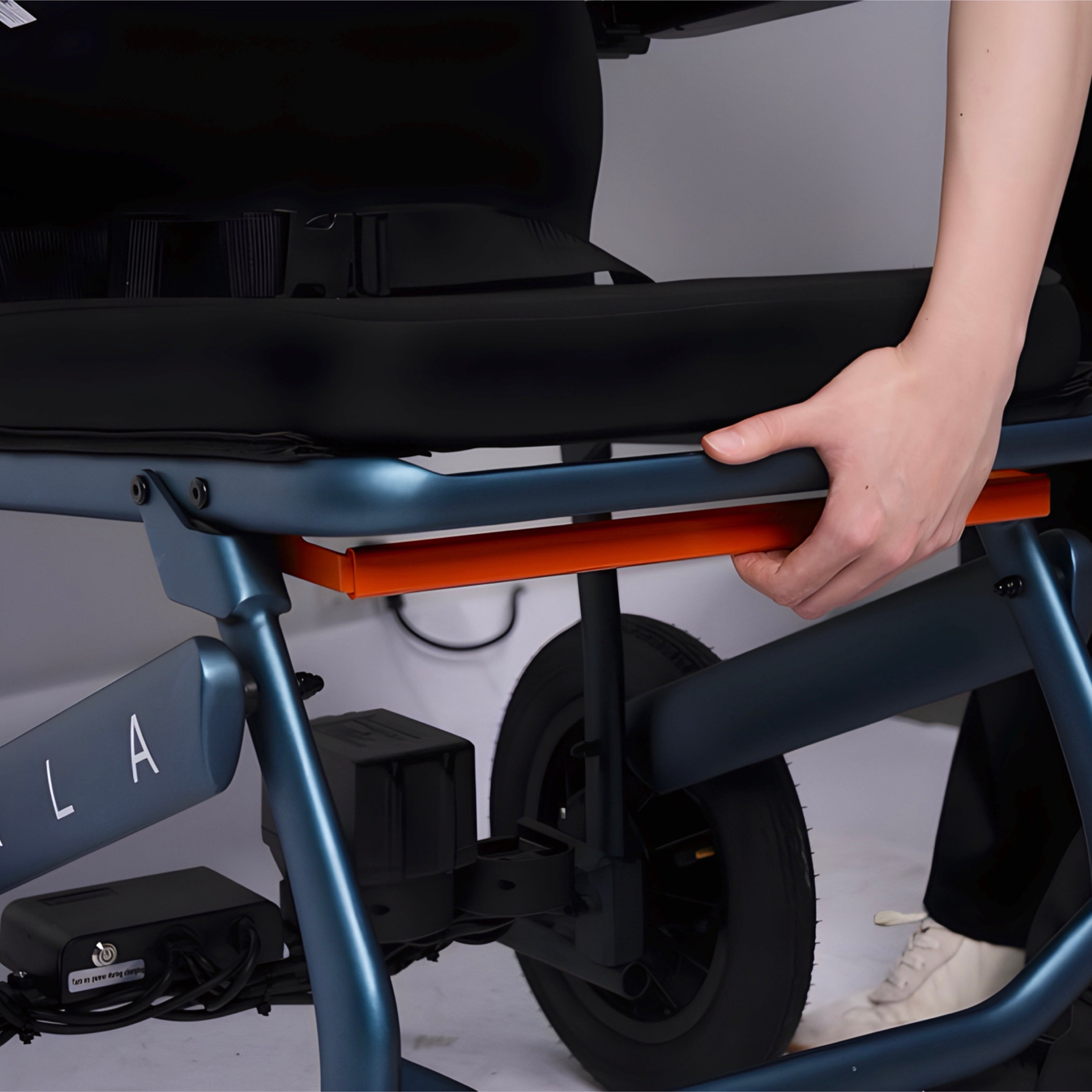 Motus - Vala World's Lightest Folding Electric Wheelchair release mechanism