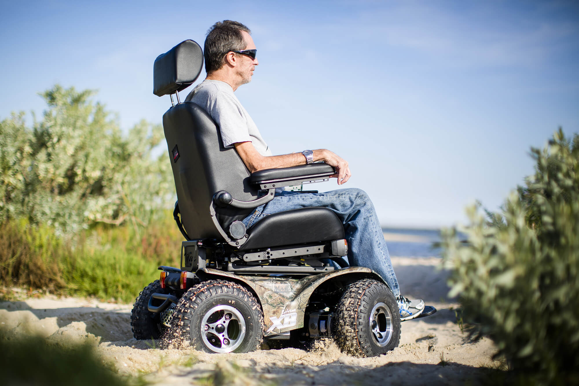 Motus - Extreme X8 all terrain power chair on a beach 
